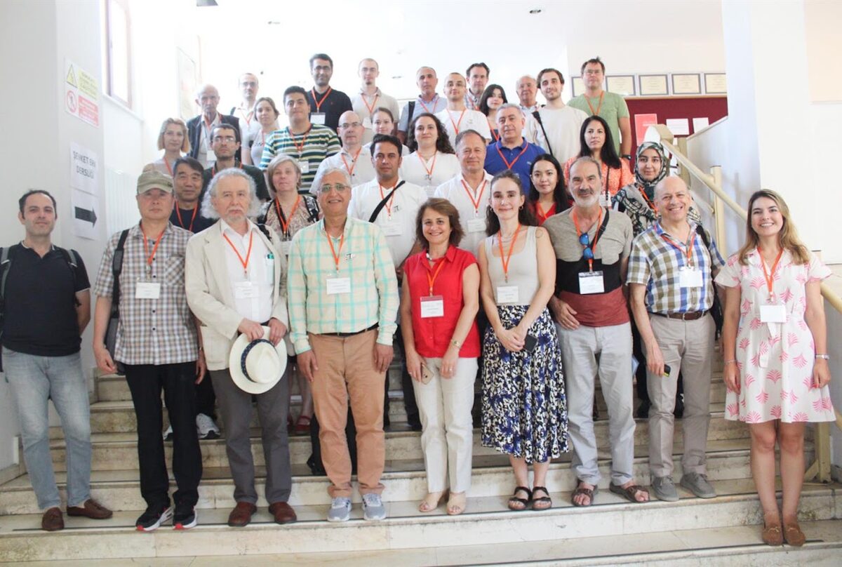 Group photo of workshop participants on a staircase